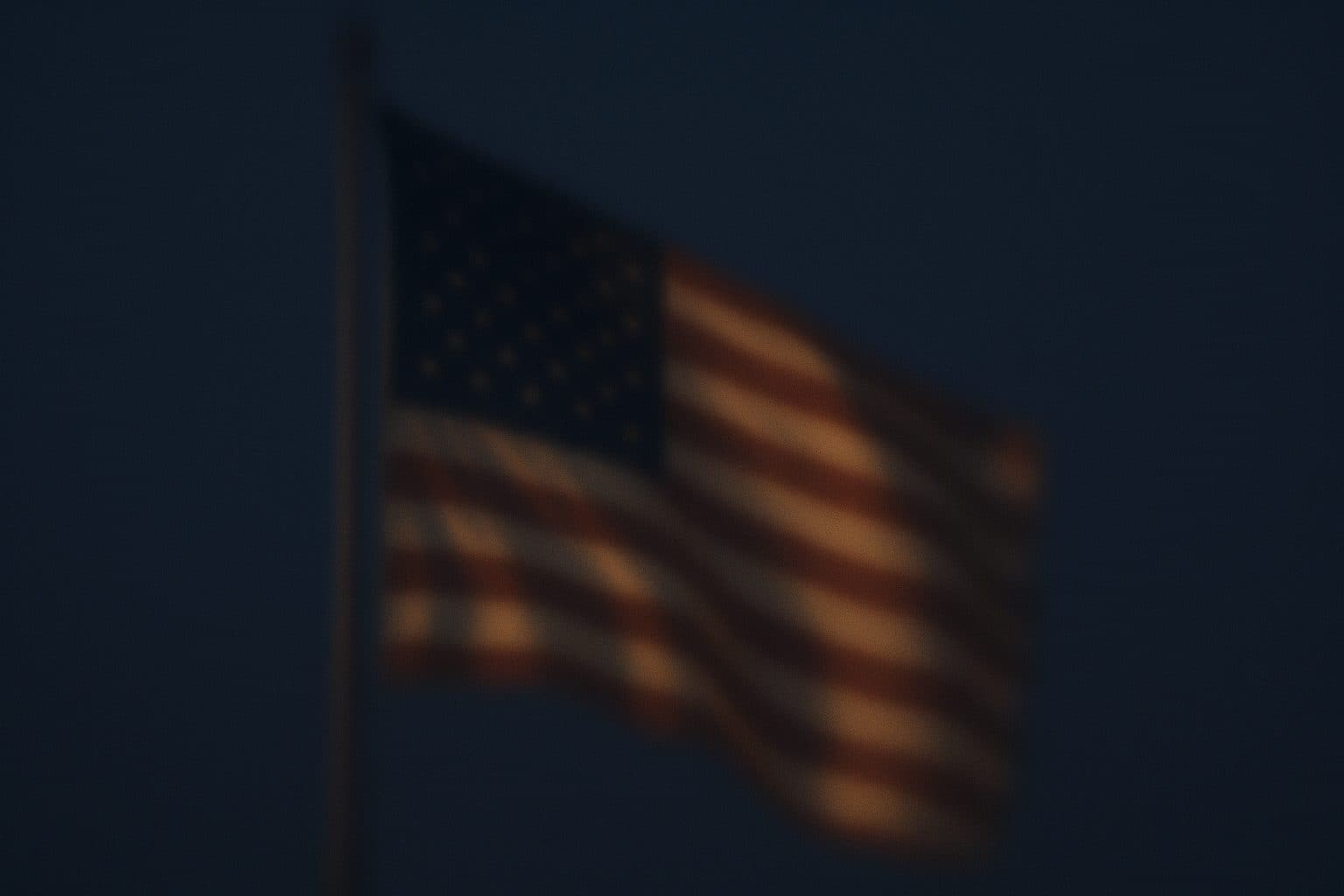 American flag against a twilight sky