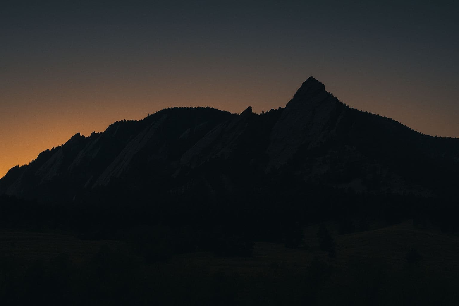 The Flatirons above Boulder at dusk